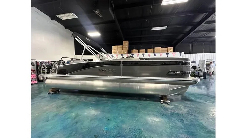 Slide: The Image of 2025 Tahoe Pontoon Cascade Cruise Rear Bench in showroom, side view. - 31