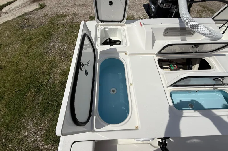 Slide: The Image of 2025 Tidewater 25 TPC Raptor boat deck with open storage compartments. - 29
