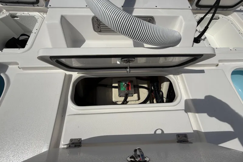 Slide: The Image of 2025 Tidewater 25 TPC Raptor boat interior with open hatch and visible wiring. - 32