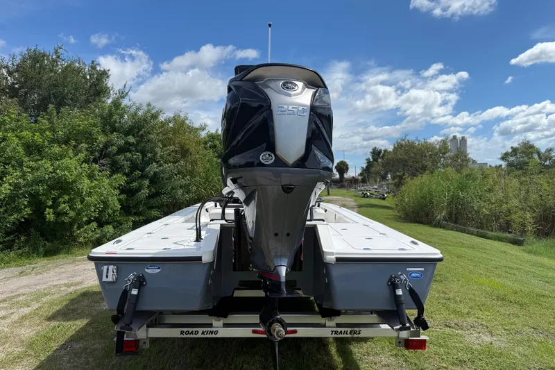 Slide: The Image of 2025 Tidewater 25 TPC Raptor boat on trailer, rear view, outdoors. - 4