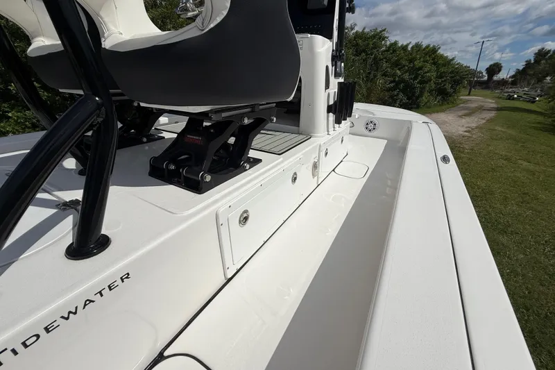 Slide: The Image of 2025 Tidewater 25 TPC Raptor boat interior with seating and storage compartments. - 40