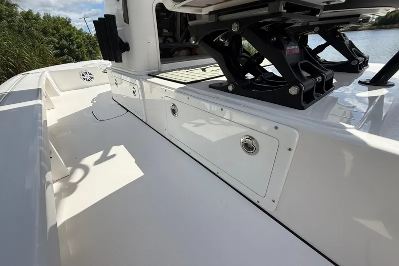 Slide: The Image of 2025 Tidewater 25 TPC Raptor boat interior with storage compartments and seating. - 45