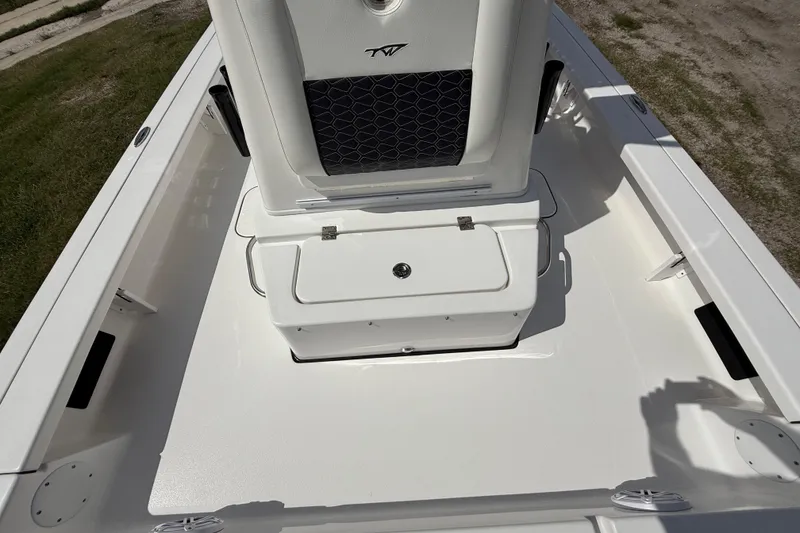 Slide: The Image of 2025 Tidewater 25 TPC Raptor boat interior with seating and storage compartment. - 49