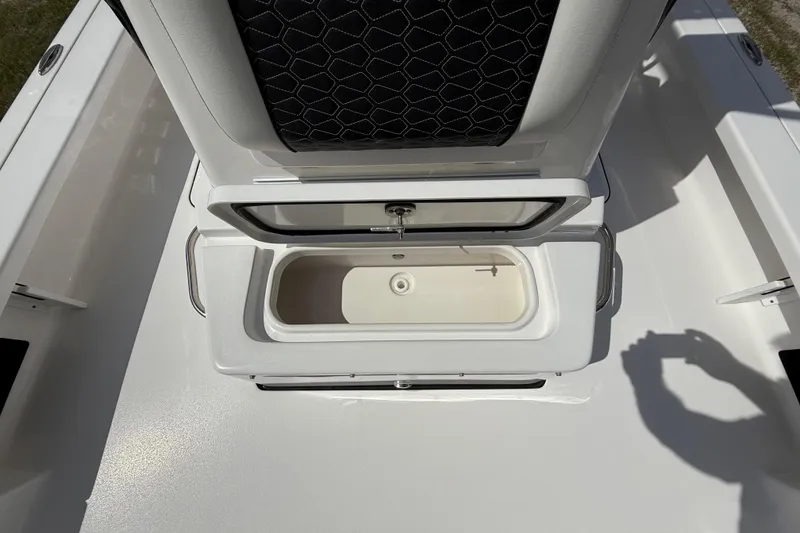 Slide: The Image of 2025 Tidewater 25 TPC Raptor boat interior with open storage compartment. - 50