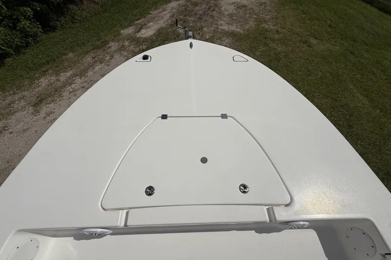 Slide: The Image of Bow view of 2025 Tidewater 25 TPC Raptor boat on grassy terrain. - 51