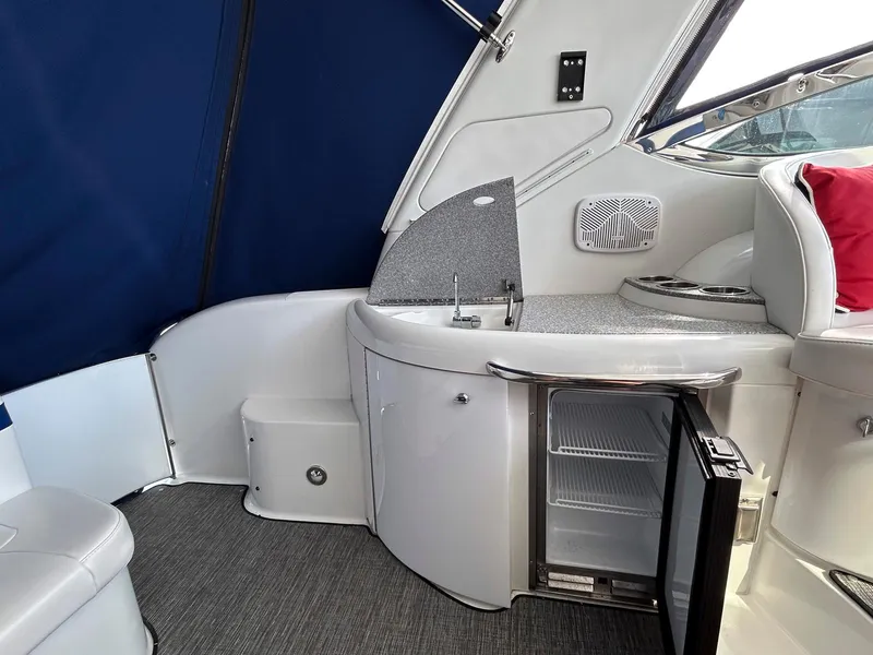 Slide: The Image of 2007 Formula 40 PC yacht interior with mini fridge, sink, and seating area. - 10