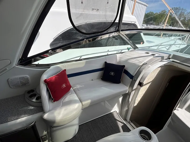 Slide: The Image of Interior of a 2007 Formula 40 PC yacht with cushioned seating and decorative pillows. - 11