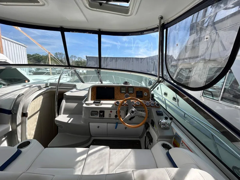 Slide: The Image of Interior view of a 2007 Formula 40 PC yacht cockpit with steering wheel and controls. - 12