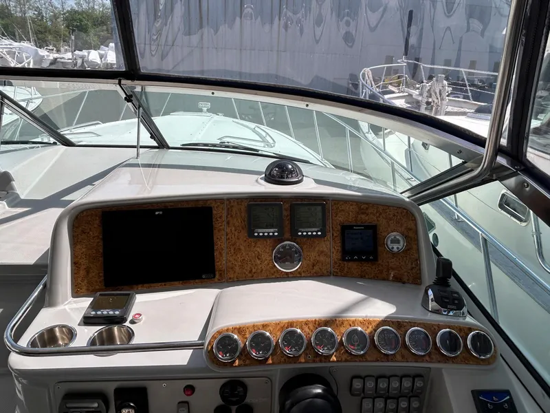 Slide: The Image of Dashboard of a 2007 Formula 40 PC boat with navigation instruments and controls. - 13