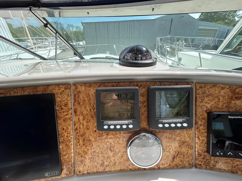 Slide: The Image of Dashboard of a 2007 Formula 40 PC boat with navigation instruments and compass. - 14