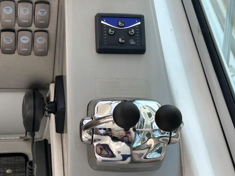 Slide: The Image of Control panel and throttle of a 2007 Formula 40 PC boat. - 17