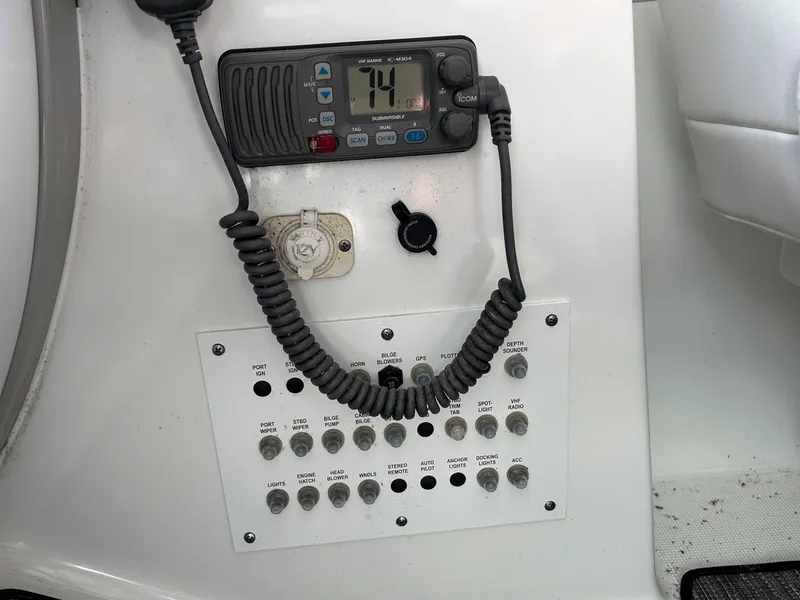 Slide: The Image of Control panel of a 2007 Formula 40 PC boat with radio and switches. - 18