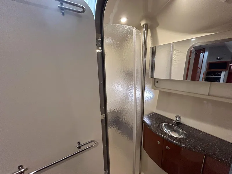 Slide: The Image of 2007 Formula 40 PC yacht bathroom with shower, sink, and mirror. - 32