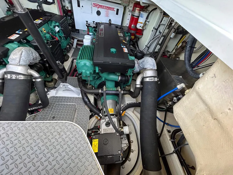 Slide: The Image of Engine room of a 2007 Formula 40 PC boat, featuring dual engines and equipment. - 36