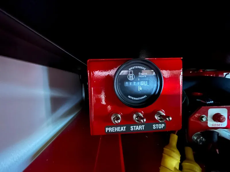 Slide: The Image of Red control panel with engine hour meter and switches on a 2007 Formula 40 PC. - 39