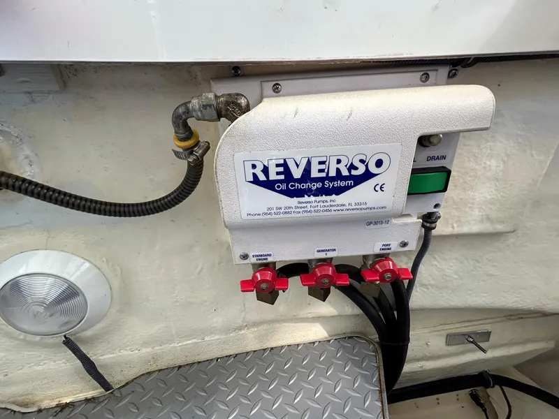Slide: The Image of Reverso oil change system in a 2007 Formula 40 PC boat engine compartment. - 40