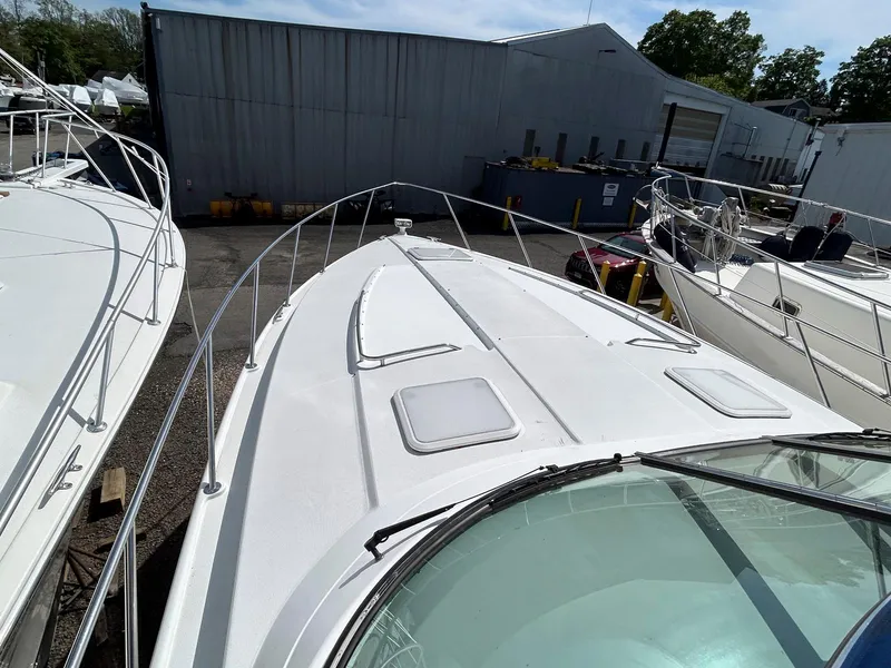 Slide: The Image of 2007 Formula 40 PC boat docked, showcasing sleek white deck and railings. - 5