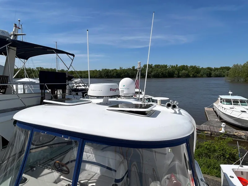 Slide: The Image of 2007 Formula 40 PC yacht docked by a river, featuring radar equipment. - 6