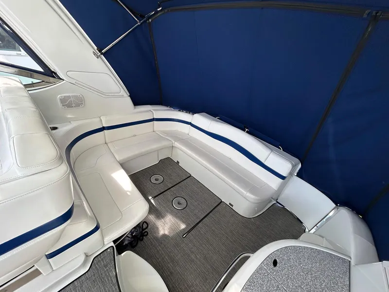 Slide: The Image of 2007 Formula 40 PC boat interior with white seating and blue accents. - 7