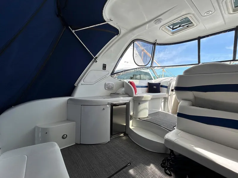 Slide: The Image of Interior of a 2007 Formula 40 PC yacht with seating and kitchenette. - 9