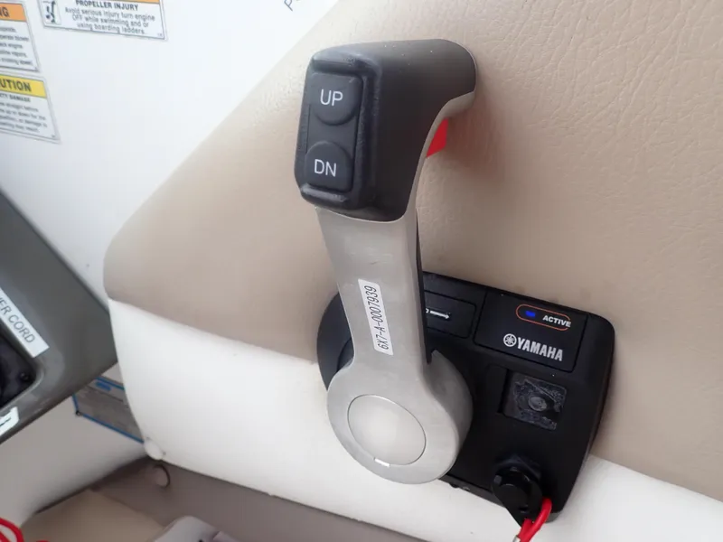 Slide: The Image of Throttle control lever on a 2016 Hurricane SunDeck 2690 OB boat. - 15
