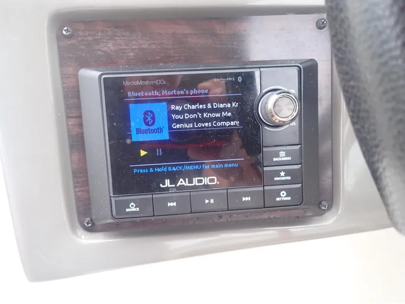 Slide: The Image of JL Audio system on 2016 Hurricane SunDeck 2690 OB, playing music via Bluetooth. - 16