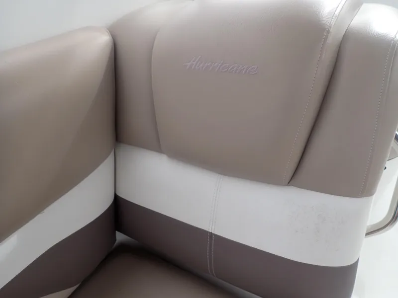 Slide: The Image of 2016 Hurricane SunDeck 2690 OB boat seat with beige and white upholstery. - 19
