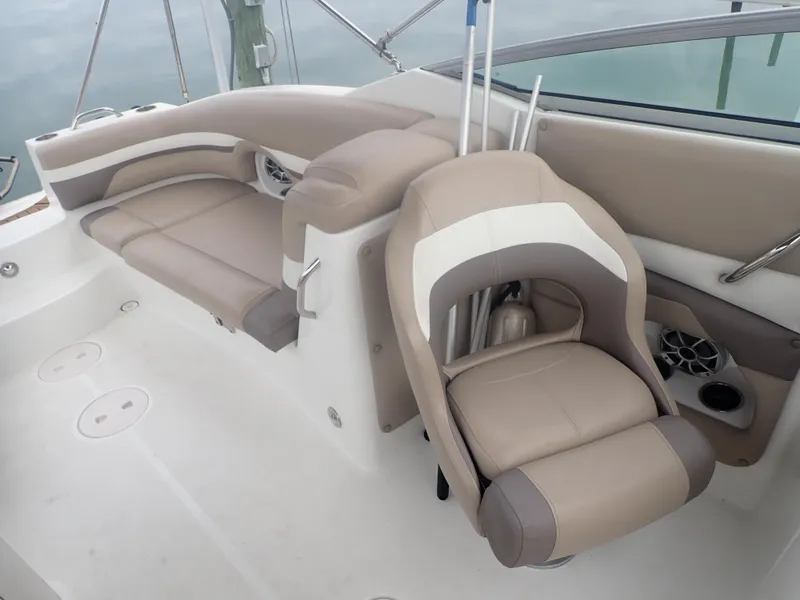 Slide: The Image of 2016 Hurricane SunDeck 2690 OB boat interior with beige seating and modern design. - 29