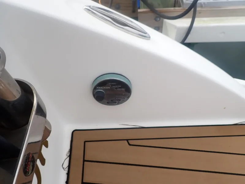 Slide: The Image of 2016 Hurricane SunDeck 2690 OB boat detail with control panel and deck flooring. - 37