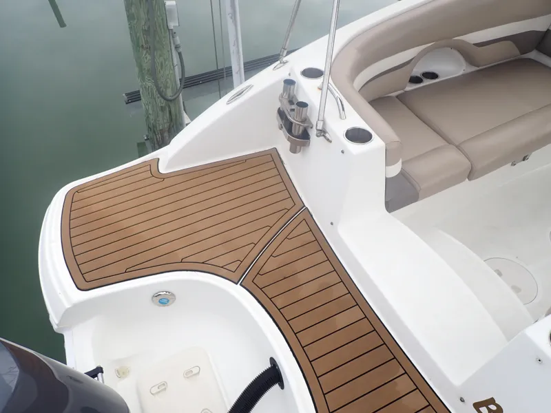 Slide: The Image of 2016 Hurricane SunDeck 2690 OB boat with teak deck and beige seating. - 38