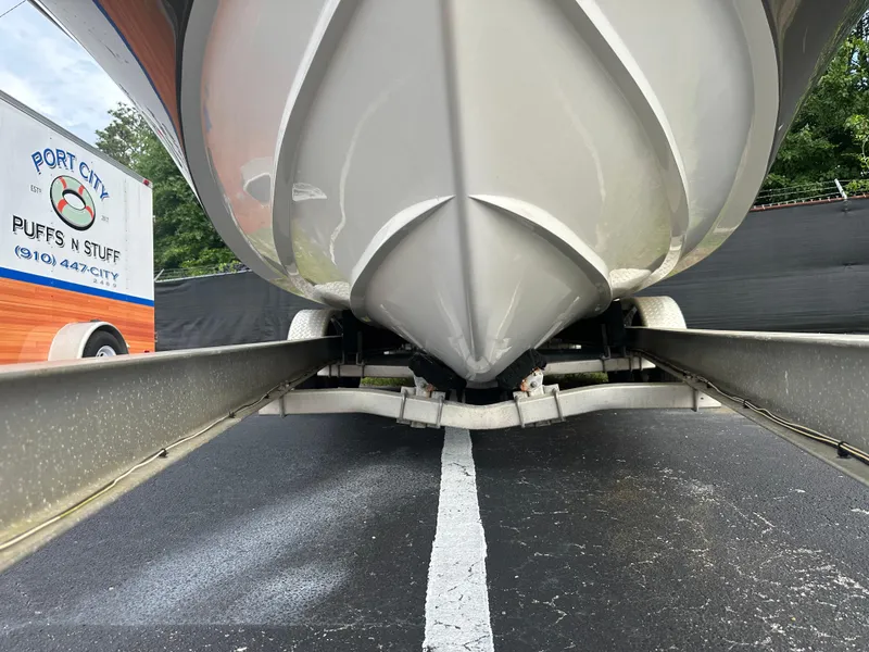 Slide: The Image of 2016 Hurricane SunDeck 2690 OB boat on trailer, viewed from below. - 5