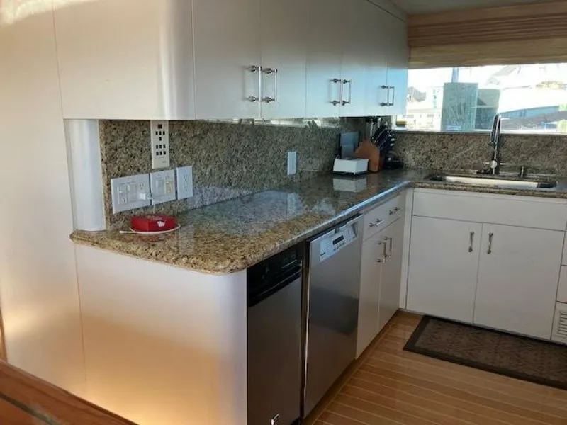 Slide: The Image of Kitchen interior of 1996 Hatteras 70 Sport Deck Motor Yacht with granite countertops. - 18