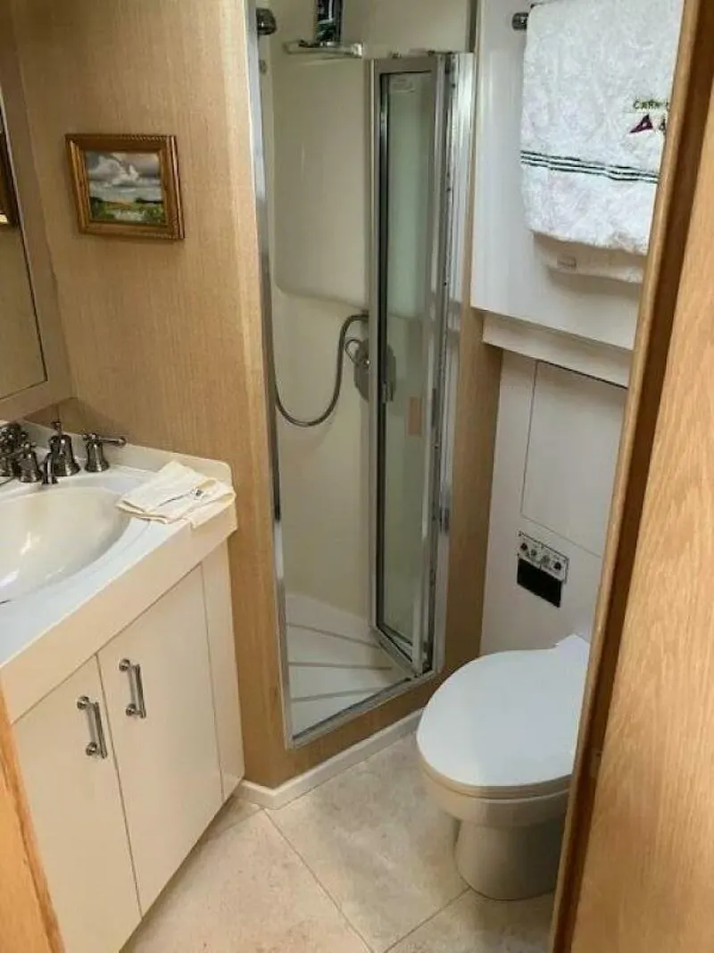 Slide: The Image of Bathroom in 1996 Hatteras 70 Sport Deck Motor Yacht with shower and sink. - 31