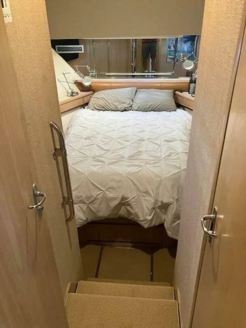 Slide: The Image of Interior cabin of 1996 Hatteras 70 Sport Deck Motor Yacht with cozy bed. - 33