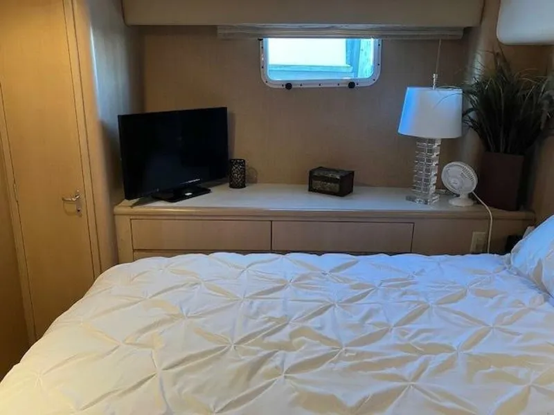 Slide: The Image of Bedroom interior of 1996 Hatteras 70 Sport Deck Motor Yacht with TV and lamp. - 37