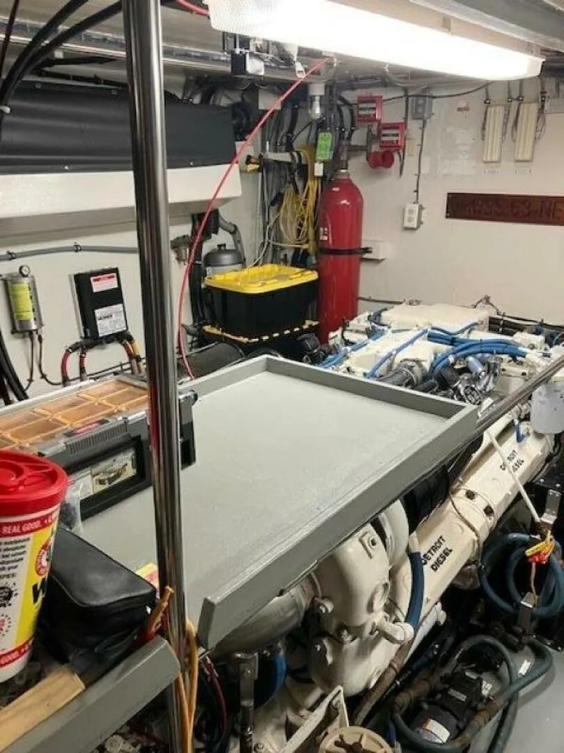 Slide: The Image of Engine room of 1996 Hatteras 70 Sport Deck Motor Yacht with visible machinery and equipment. - 40