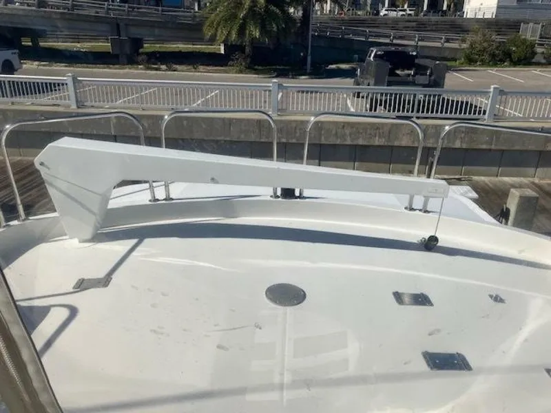 Slide: The Image of 1996 Hatteras 70 Sport Deck Motor Yacht bow with railing and davit. - 5