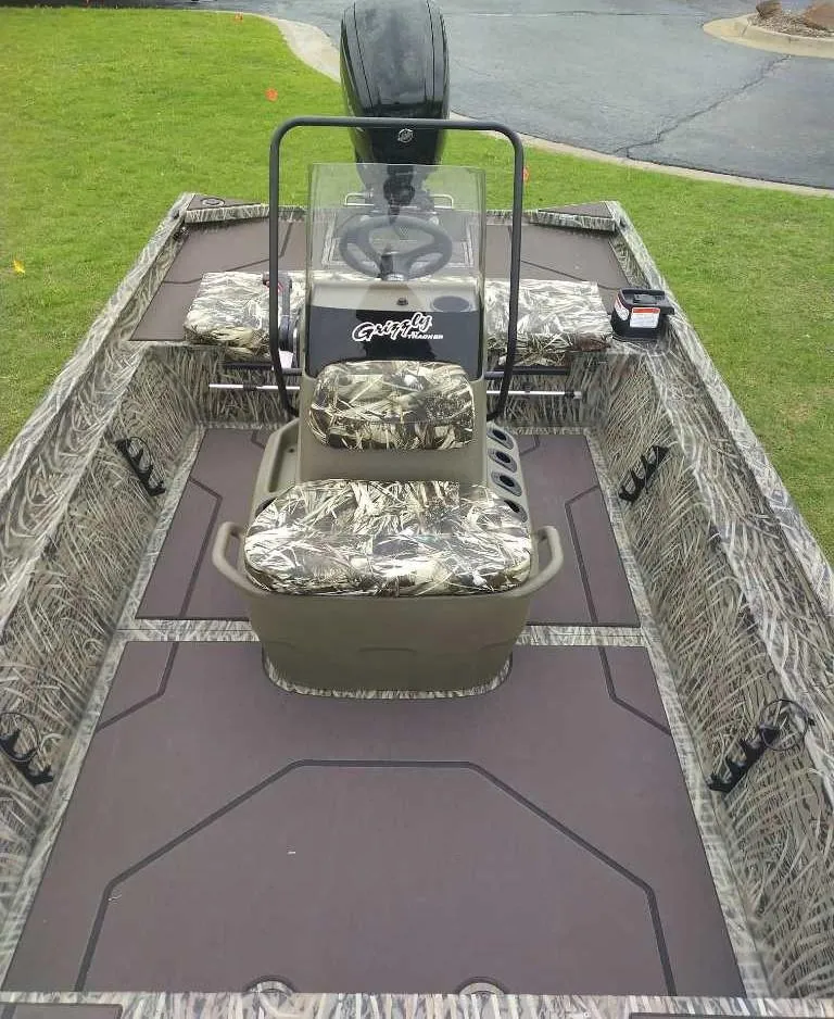 Slide: The Image of 2025 Tracker Grizzly 1860 CC boat with camouflage seating and spacious deck. - 6