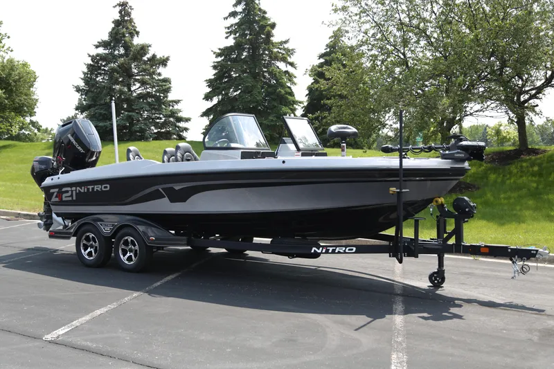 The Image of 2025 Nitro ZV21 Pro boat on trailer in parking lot. - 0