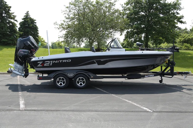 Slide: The Image of 2025 Nitro ZV21 Pro fishing boat on trailer in parking lot. - 1