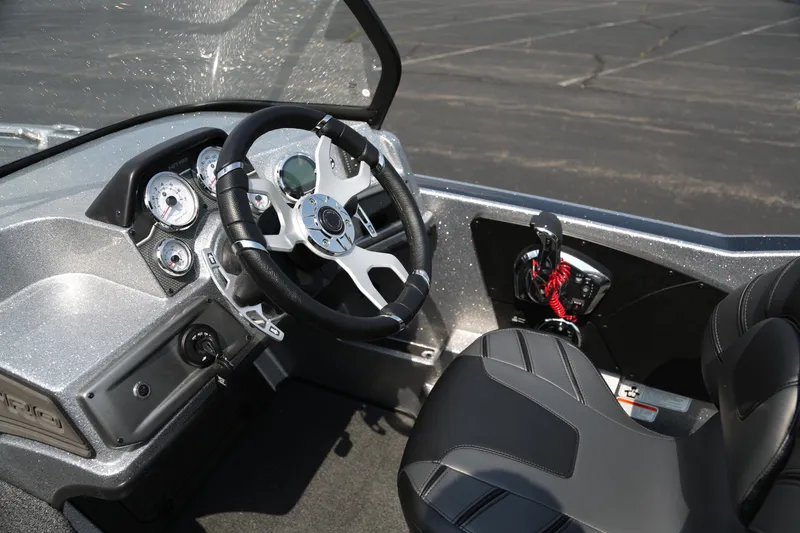 Slide: The Image of Interior of 2025 Nitro ZV21 Pro boat, featuring steering wheel and dashboard controls. - 5