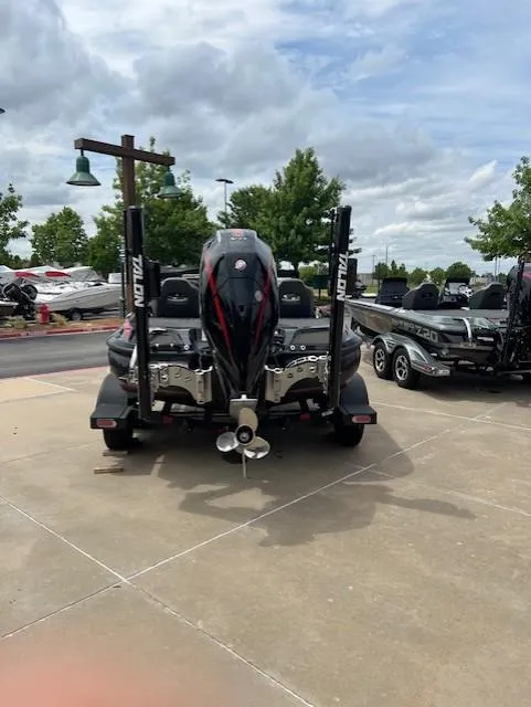 Slide: The Image of 2023 Nitro Z19 Pro boat parked outdoors, showcasing rear view and motor. - 2