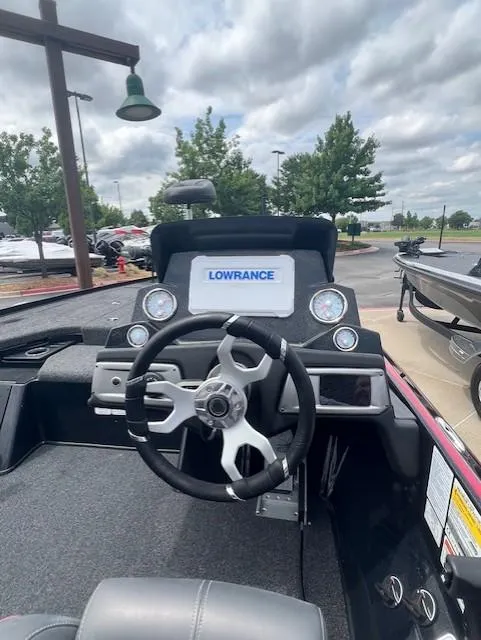 Slide: The Image of 2023 Nitro Z19 Pro boat dashboard with Lowrance display and steering wheel. - 3