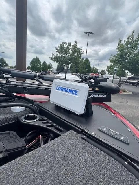 Slide: The Image of 2023 Nitro Z19 Pro boat with Lowrance equipment, parked outdoors under cloudy skies. - 5