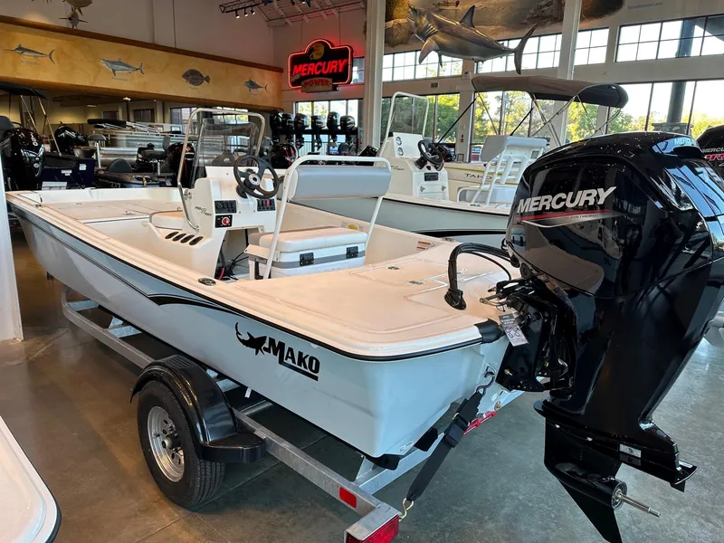 Slide: The Image of 2025 Mako Pro Skiff 17 CC boat with Mercury engine in showroom. - 43
