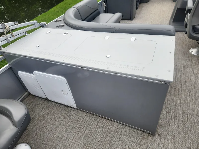 Slide: The Image of 2022 Avalon GS RF 2385 boat interior with gray seating and storage compartments. - 12