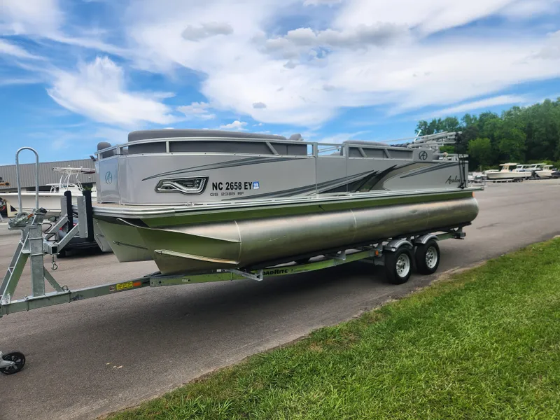 Slide: The Image of 2022 Avalon GS RF 2385 pontoon boat on trailer under a blue sky. - 6