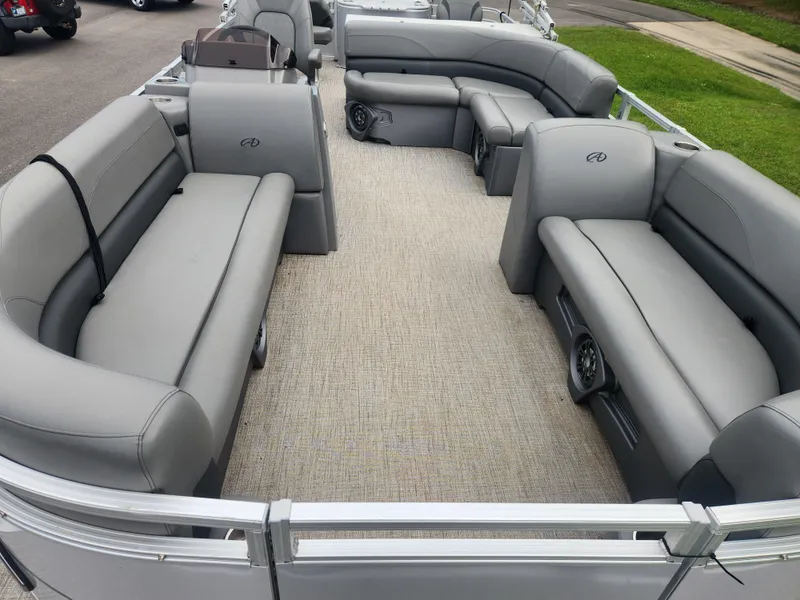Slide: The Image of 2022 Avalon GS RF 2385 pontoon boat with spacious gray seating and carpeted deck. - 7