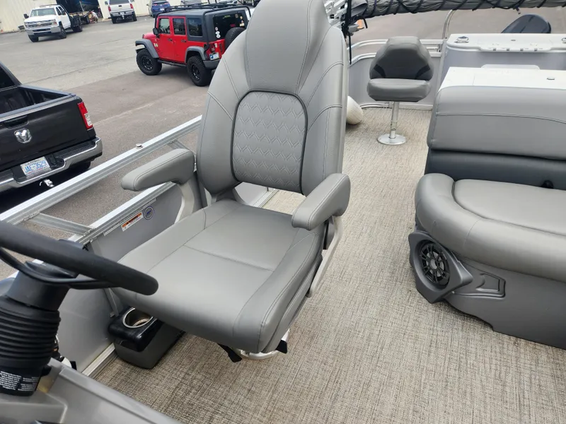Slide: The Image of 2022 Avalon GS RF 2385 boat interior with gray seating and steering wheel. - 9