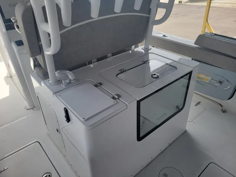 Slide: The Image of 2025 Sea Hunt Gamefish 28 Forward Seating boat interior with storage compartments. - 10